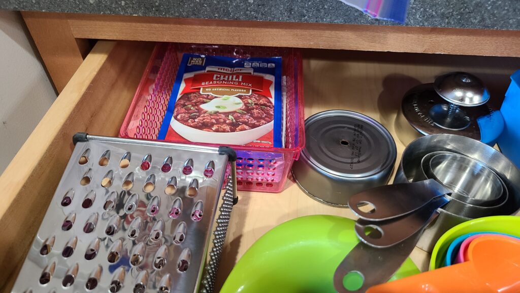 A closeup of the inside of a kitchen drawer.
