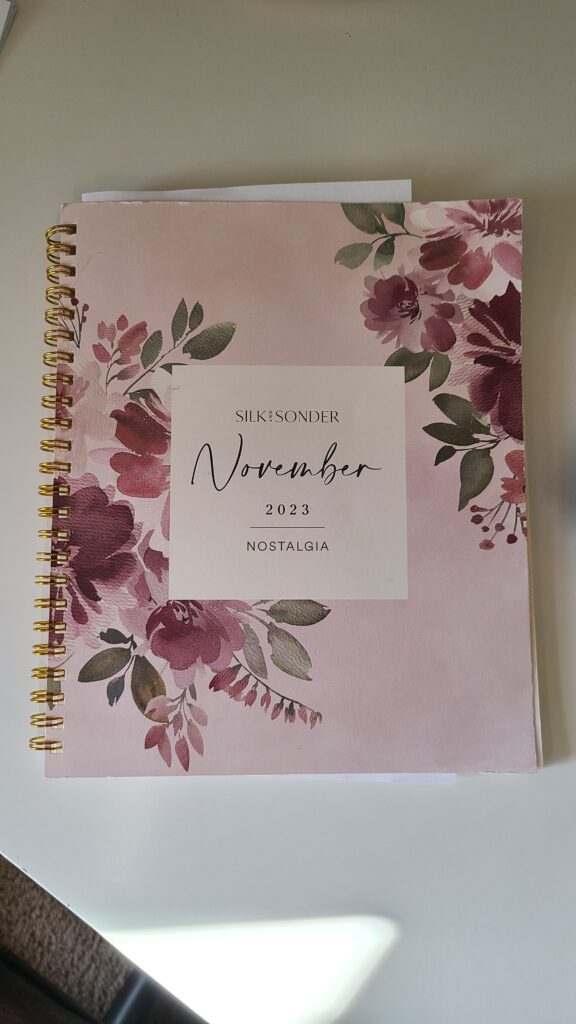 A small planner on a desk top
