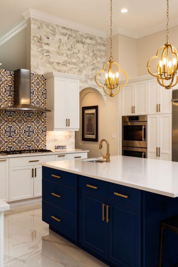 A narrow view of a kitchen. The cabinets and counters are white and cleared.