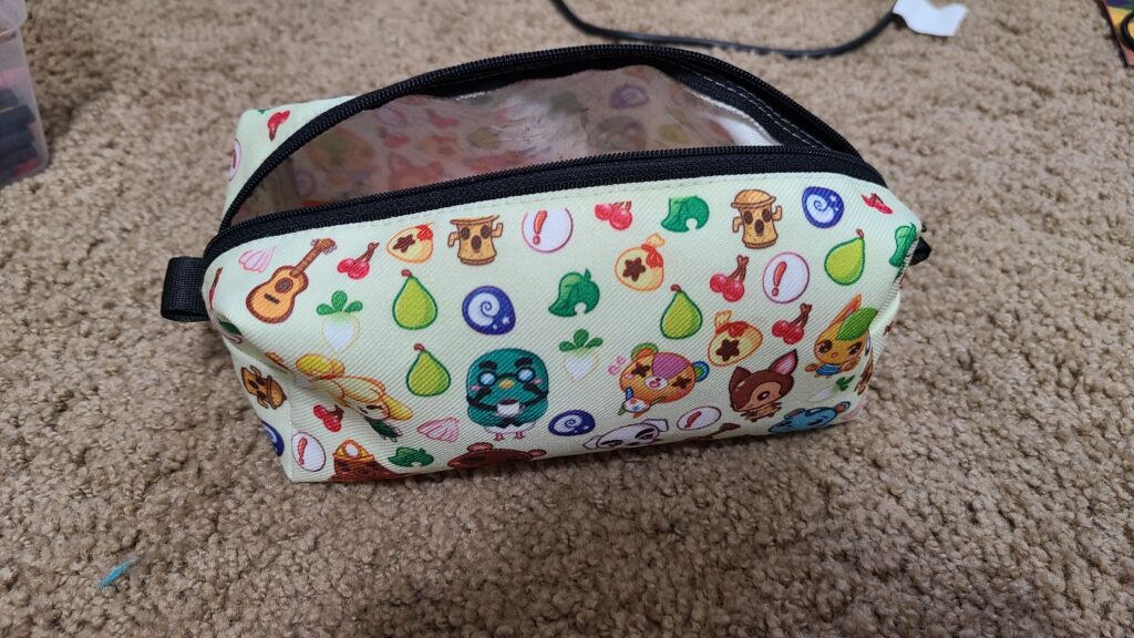 A pencil case, with Animal Crossing decorations