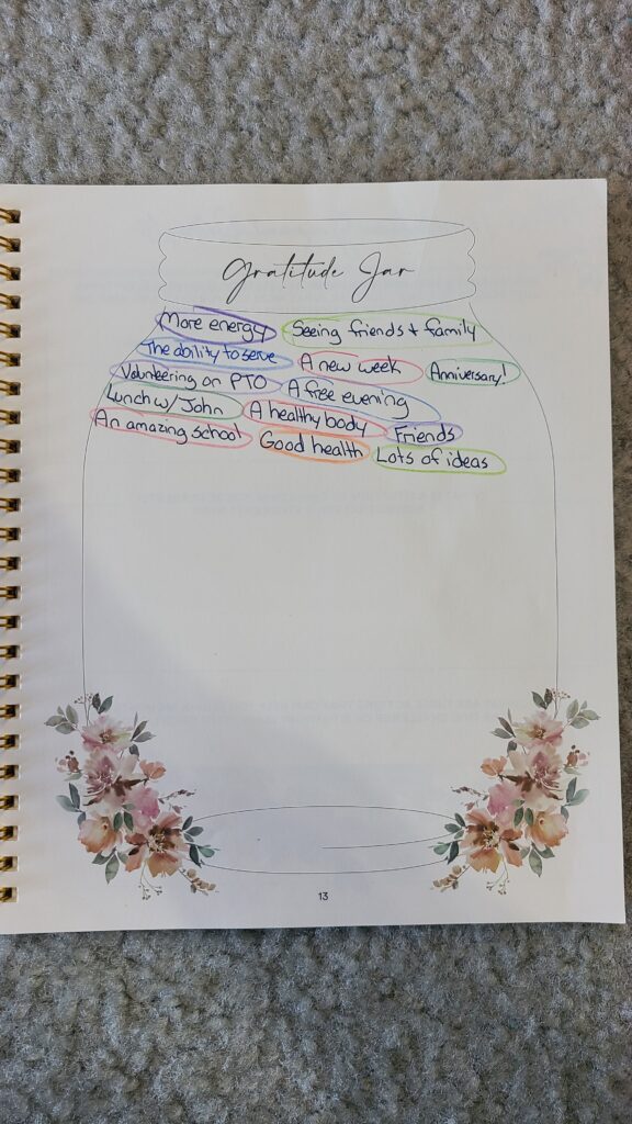An opened Silk and Sonder planner, to the Gratitude Jar page