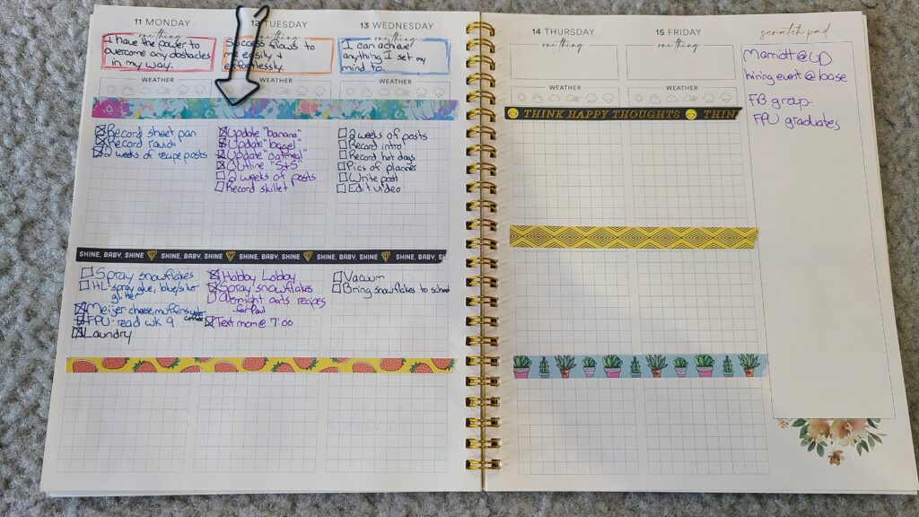 An opened Silk and Sonder planner, opened up to the filled-out daily spread pages