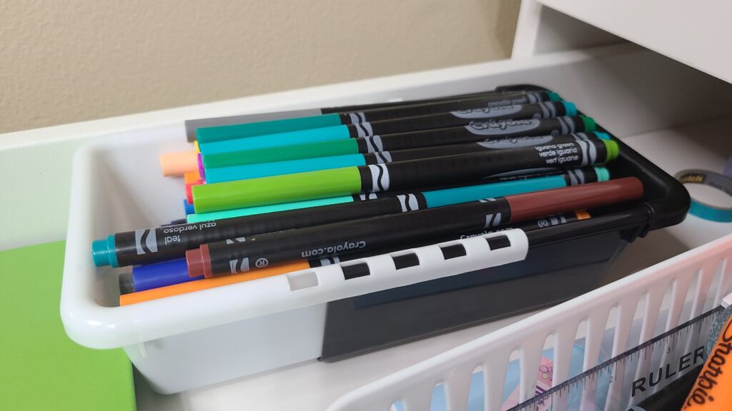 A small basket of fine-tip markers