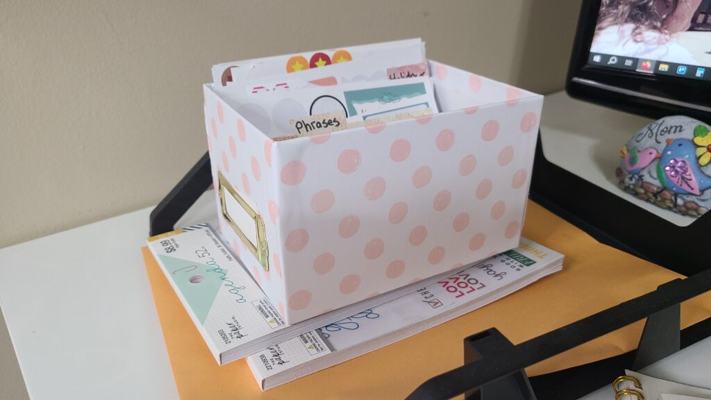 A small box filled with planner stickers