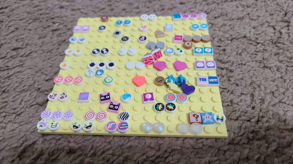 A medium-sized LEGO base, holding miscellaneous LEGO Dots