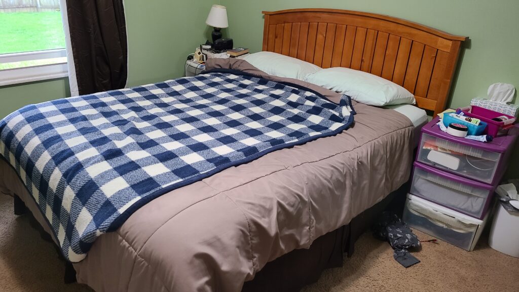 A made bed in a bedroom