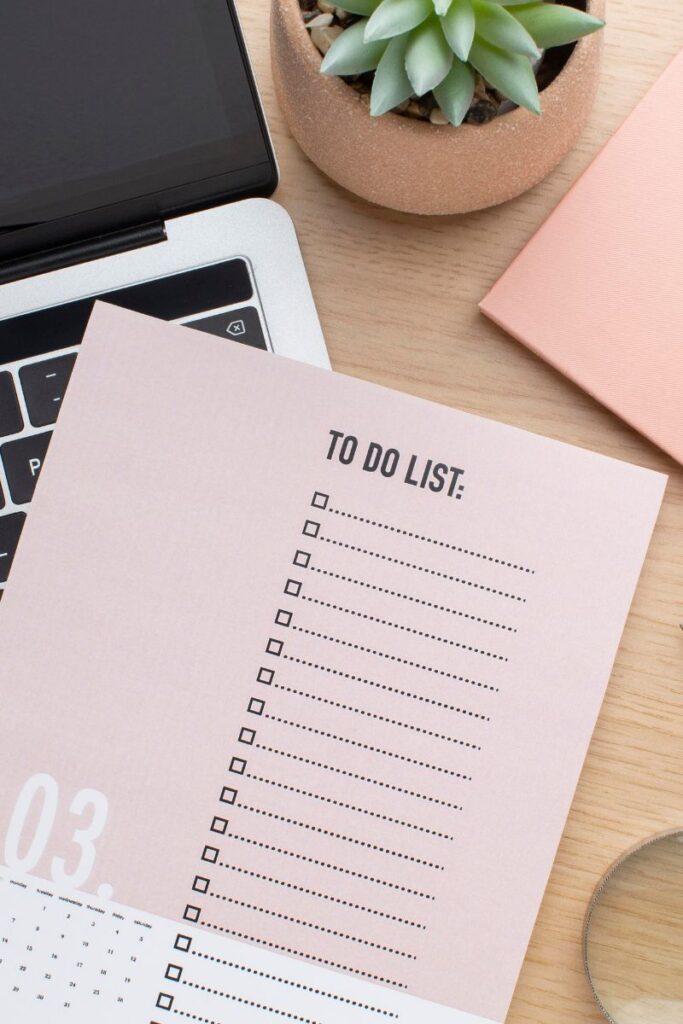 A to-do list sitting on top of a keyboard