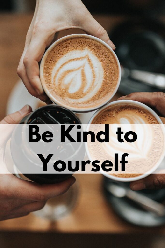 3 hands holding mugs of coffee to each other. Text says "Be kind to yourself"