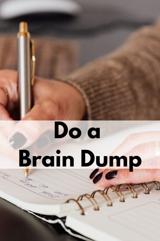 A person writing in a journal. Text says "Do a brain dump"