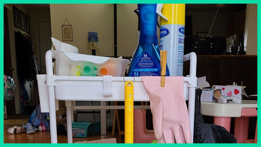 A rolling cart filled with cleaning supplies