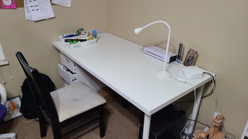 A cleared-off white office table